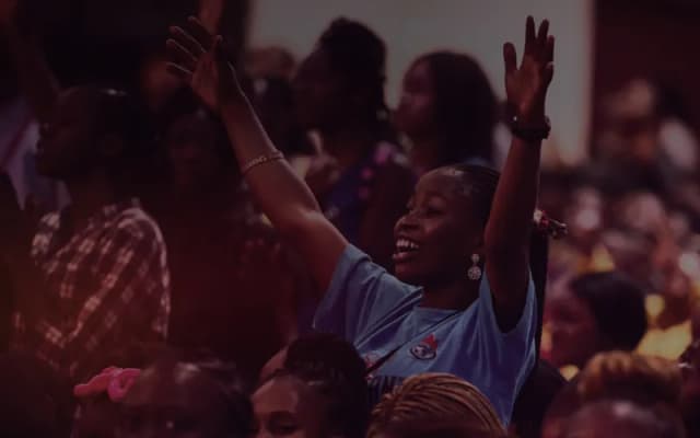 Youth worship with hands raised