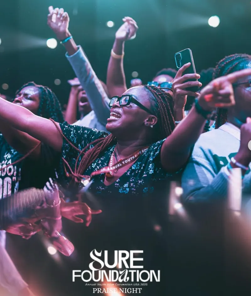 Crowd worshipping with phones up