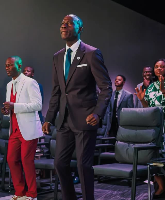 Leaders standing in worship at AYAC USA