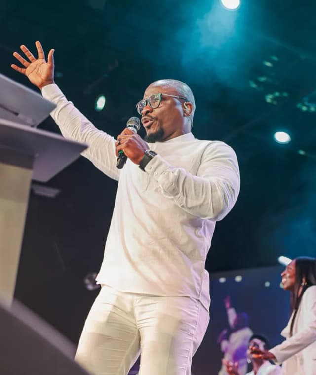 Pastor in white preaching at AYAC USA