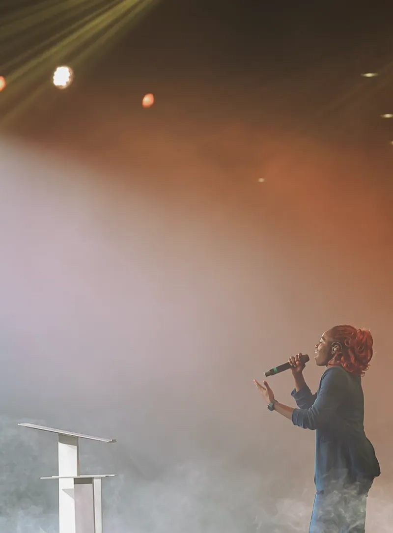 Singer on hazy stage at AYAC USA