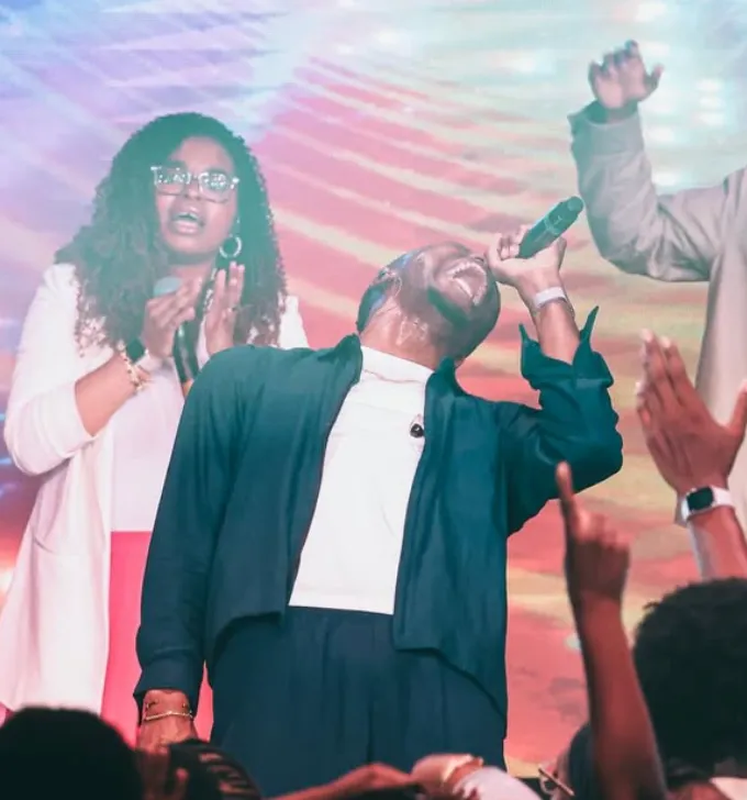 Worship duo with hands raised at AYAC USA