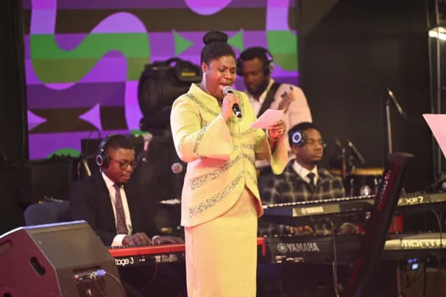 Choir leader with band at YAF Canada