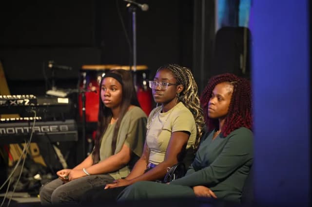 Young women listening at YAF Canada