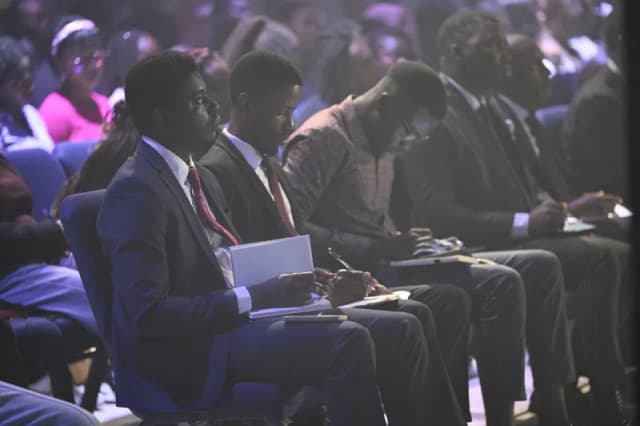 Youth taking notes during service